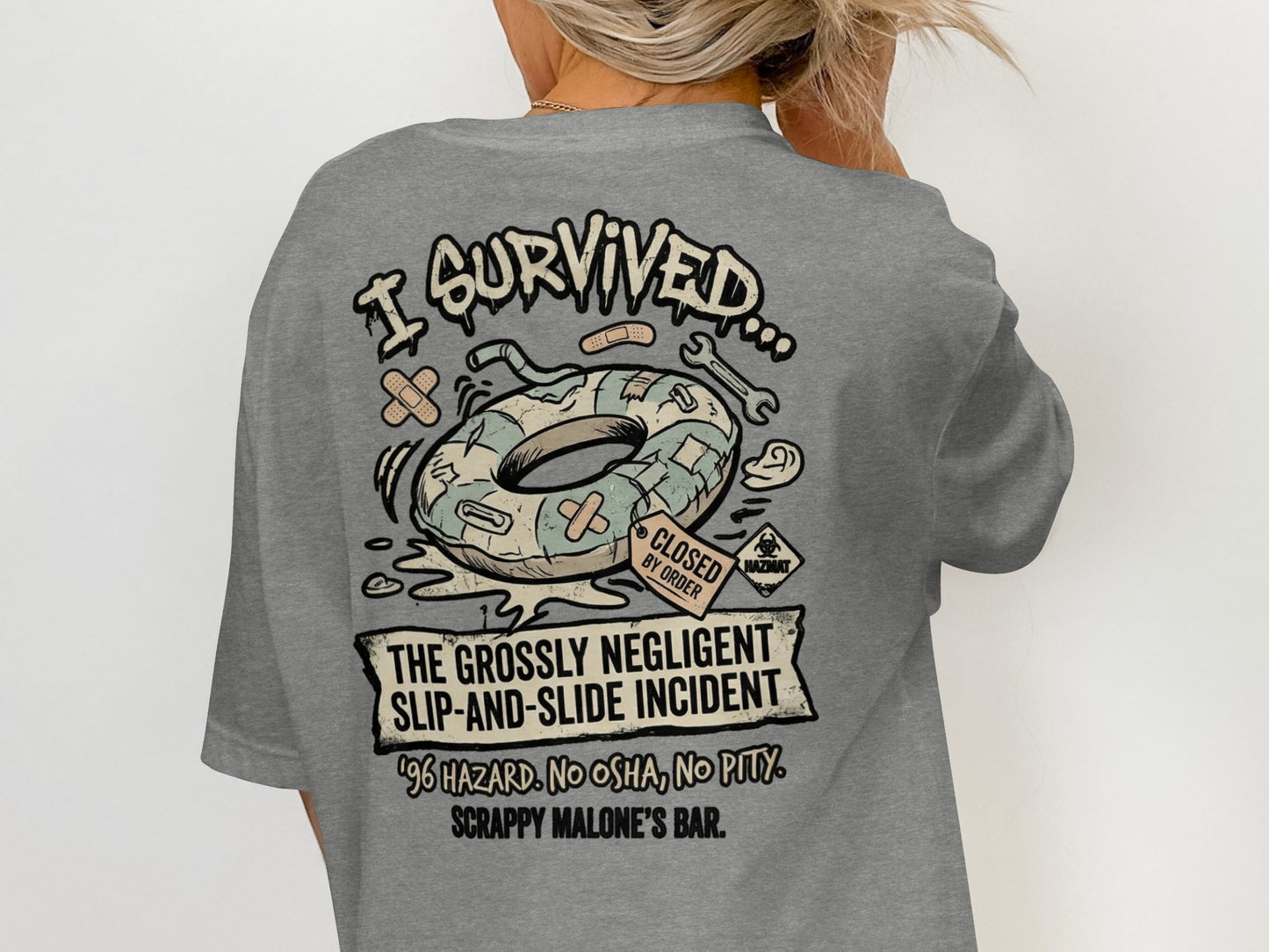 T-shirt graphic: "I survived the grossly negligent slip-and-slide incident" at Scrappy Malone's Bar.