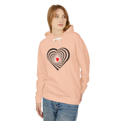 Woman wearing a peach hoodie with a heart design on a white background