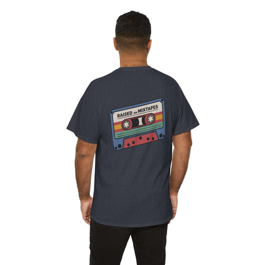 Person wearing a dark gray t-shirt with a colorful cassette tape graphic on the back, set against a white background.