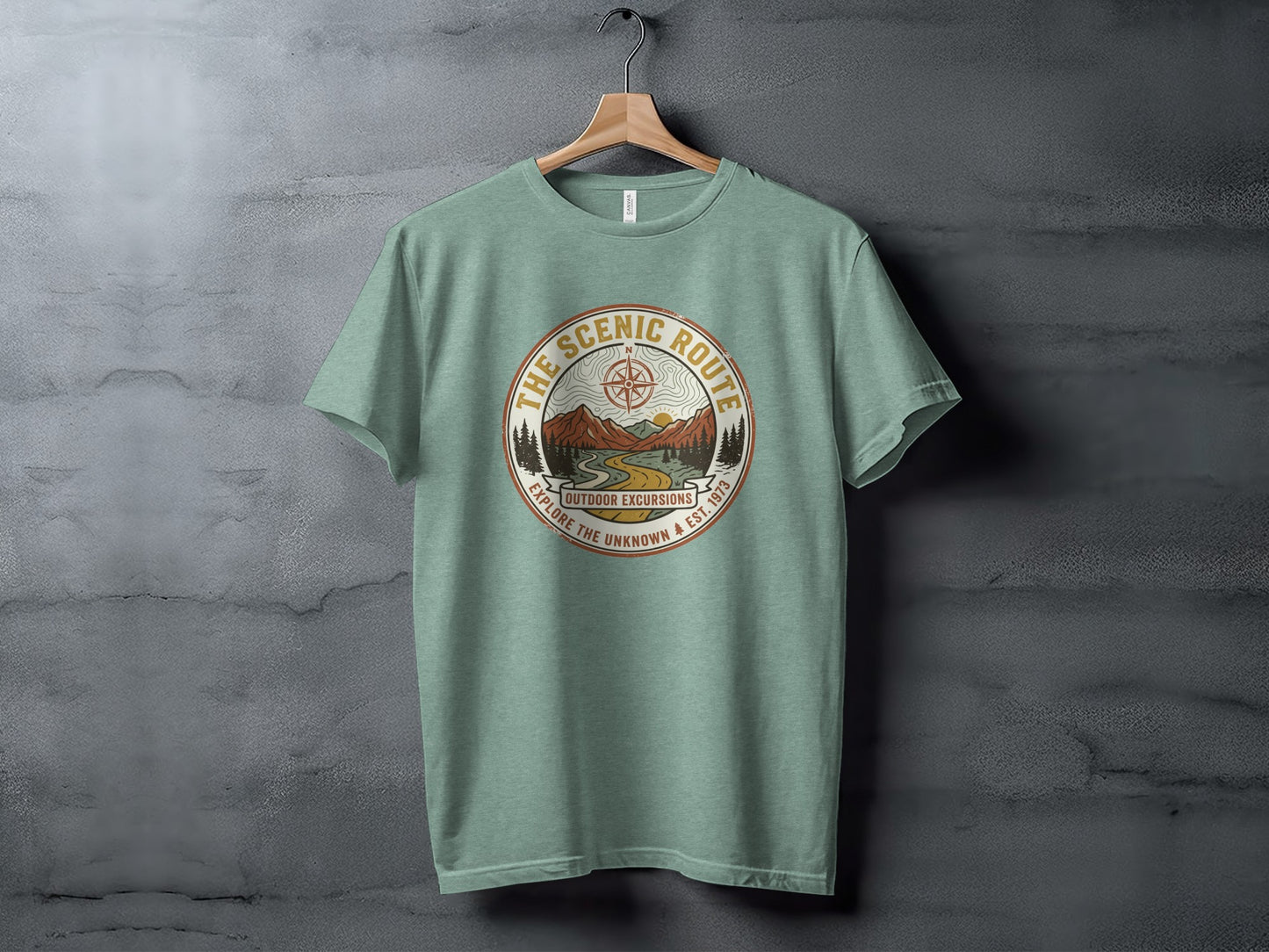 Heritage Scenic Route Vintage Explorer Tee Nomad Tee: Green t-shirt with "The Scenic Route Outdoor Excursions" circular graphic.