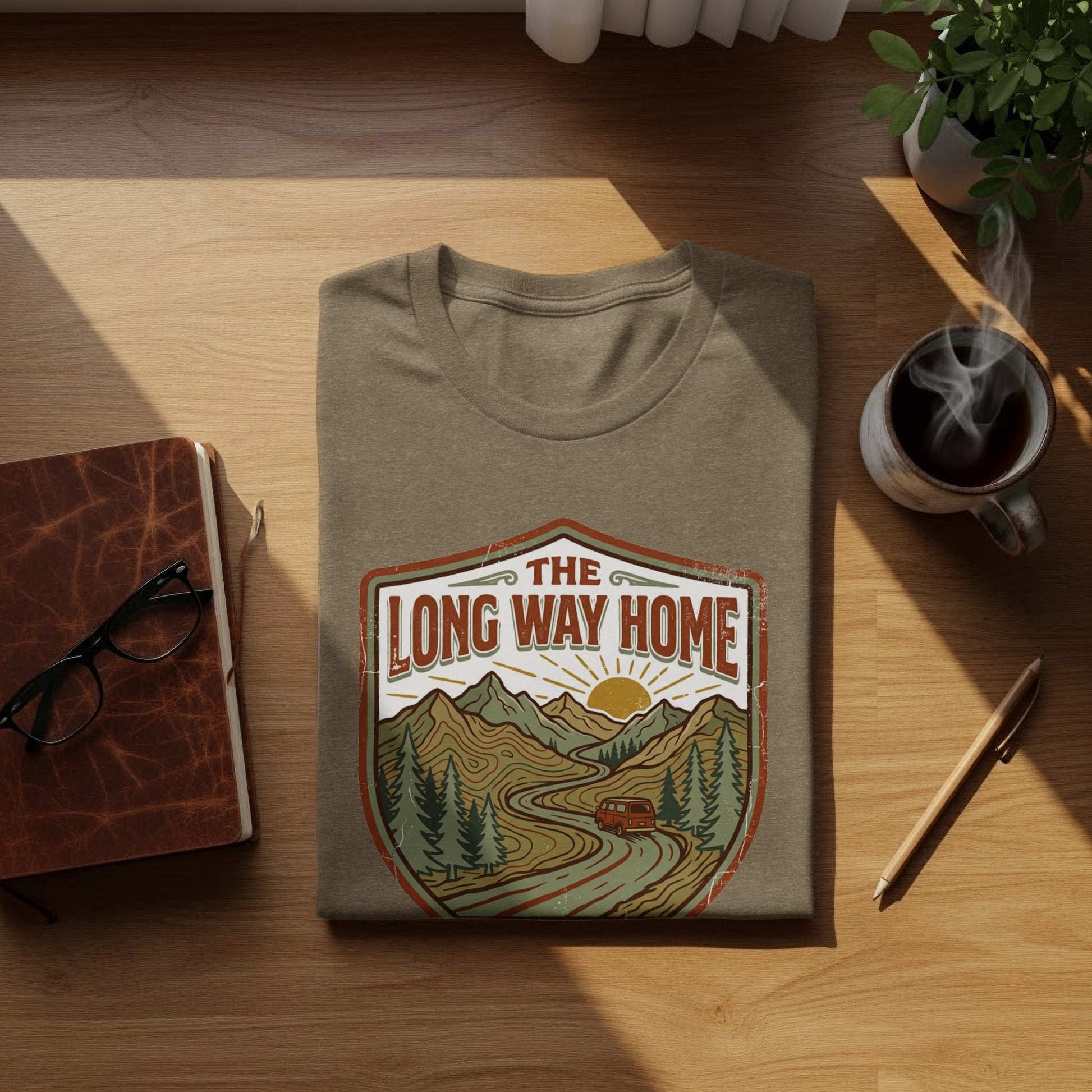 Rugged The Long Way Home | Vintage Adventure Wilderness Shirt: T-shirt with "The Long Way Home" graphic featuring a winding road through mountains and a sunset.