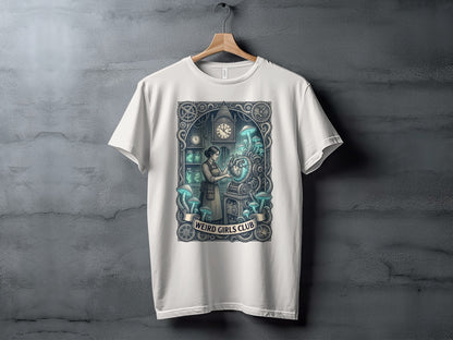 White t-shirt with a "Weird Girls Club" graphic featuring a woman and steampunk machinery.