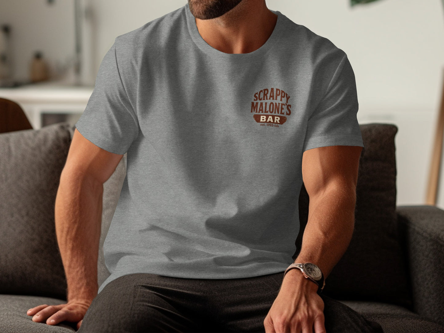 Grey t-shirt with "Scrappy Malone's Bar Est. 1992" logo on the chest.