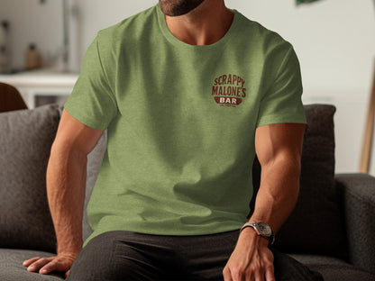 Green t-shirt with "Scrappy Malone's Bar Est. 1992" logo on chest.