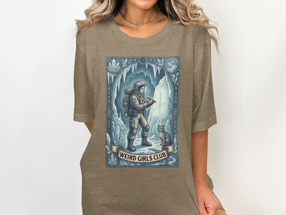 Astronaut and cat in icy cave, "Weird Girls Club" text.