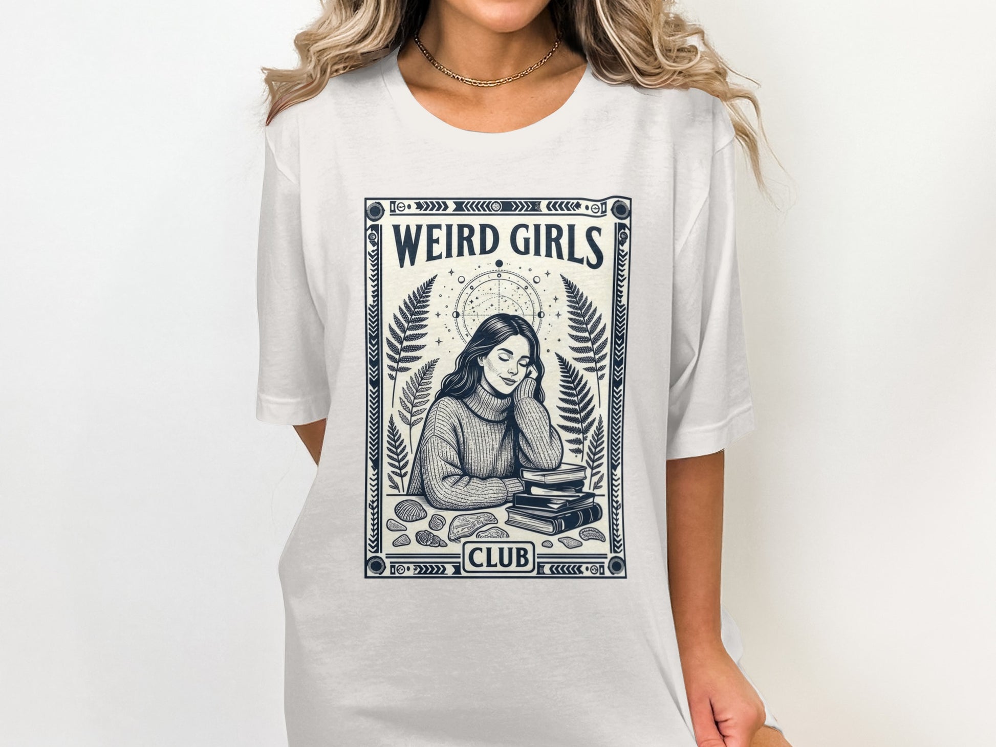 White t-shirt with "WEIRD GIRLS CLUB" text and mystical illustration.