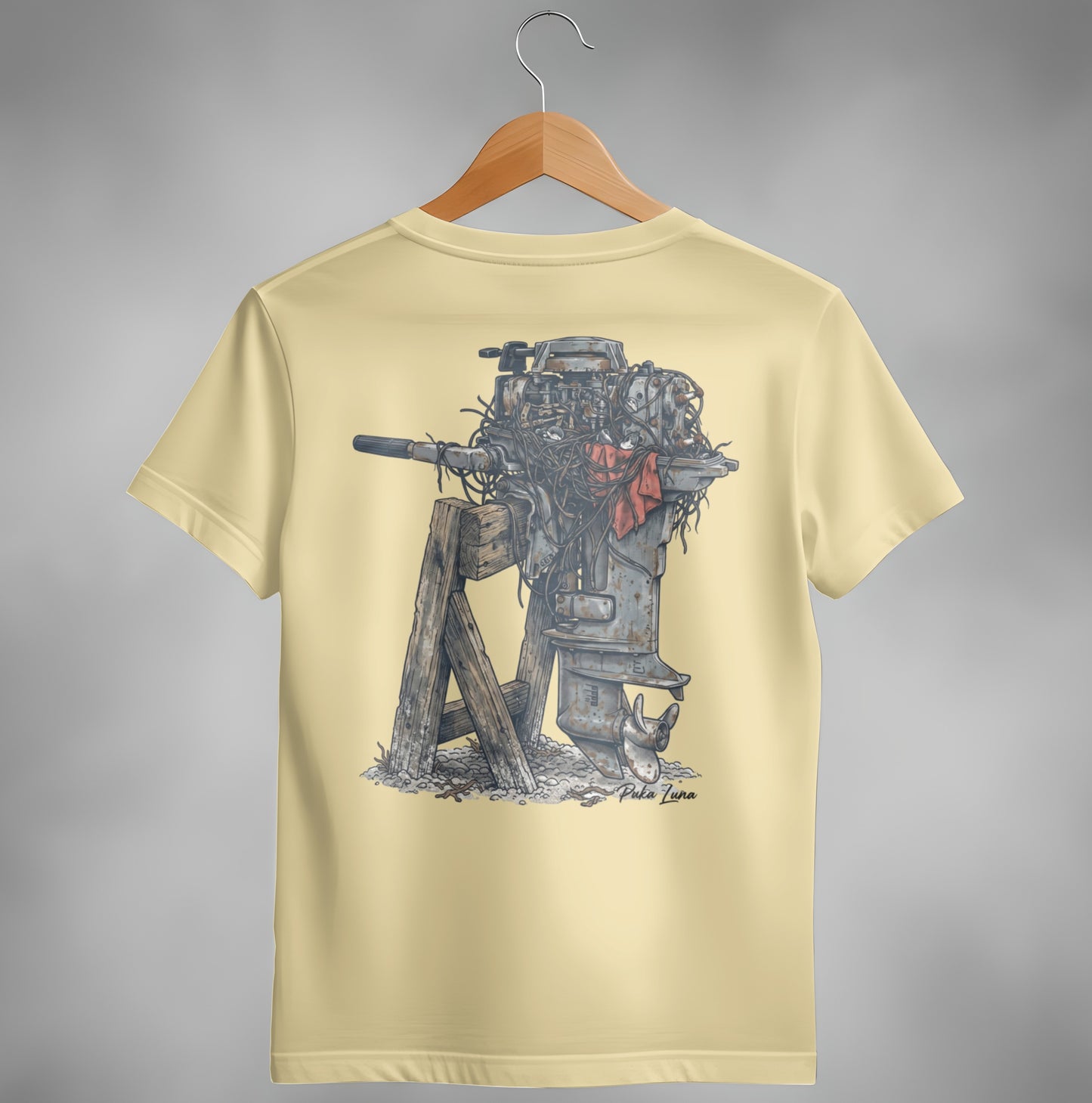 Outboard motor diagram on a light yellow t-shirt.