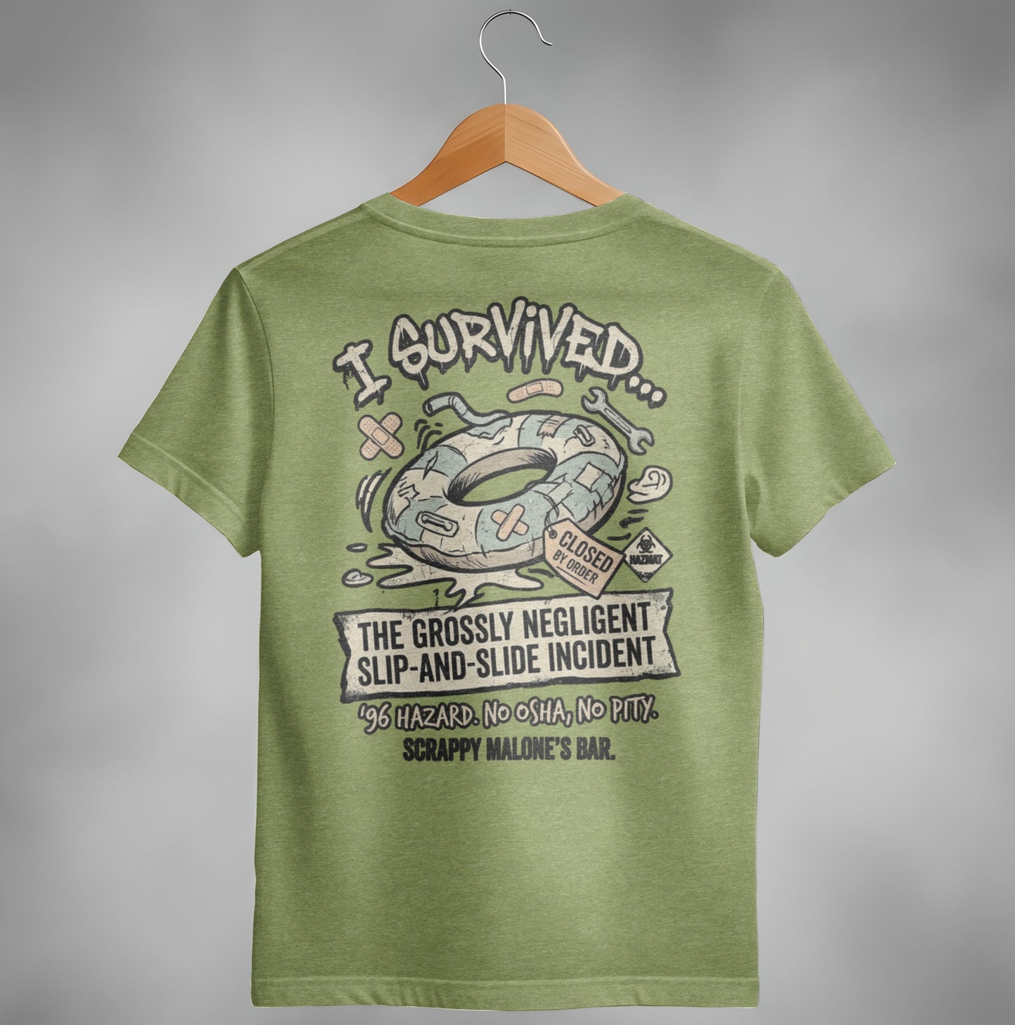 T-shirt graphic: "I Survived" doughnut float, hazard symbols, text about negligent slip-and-slide incident.