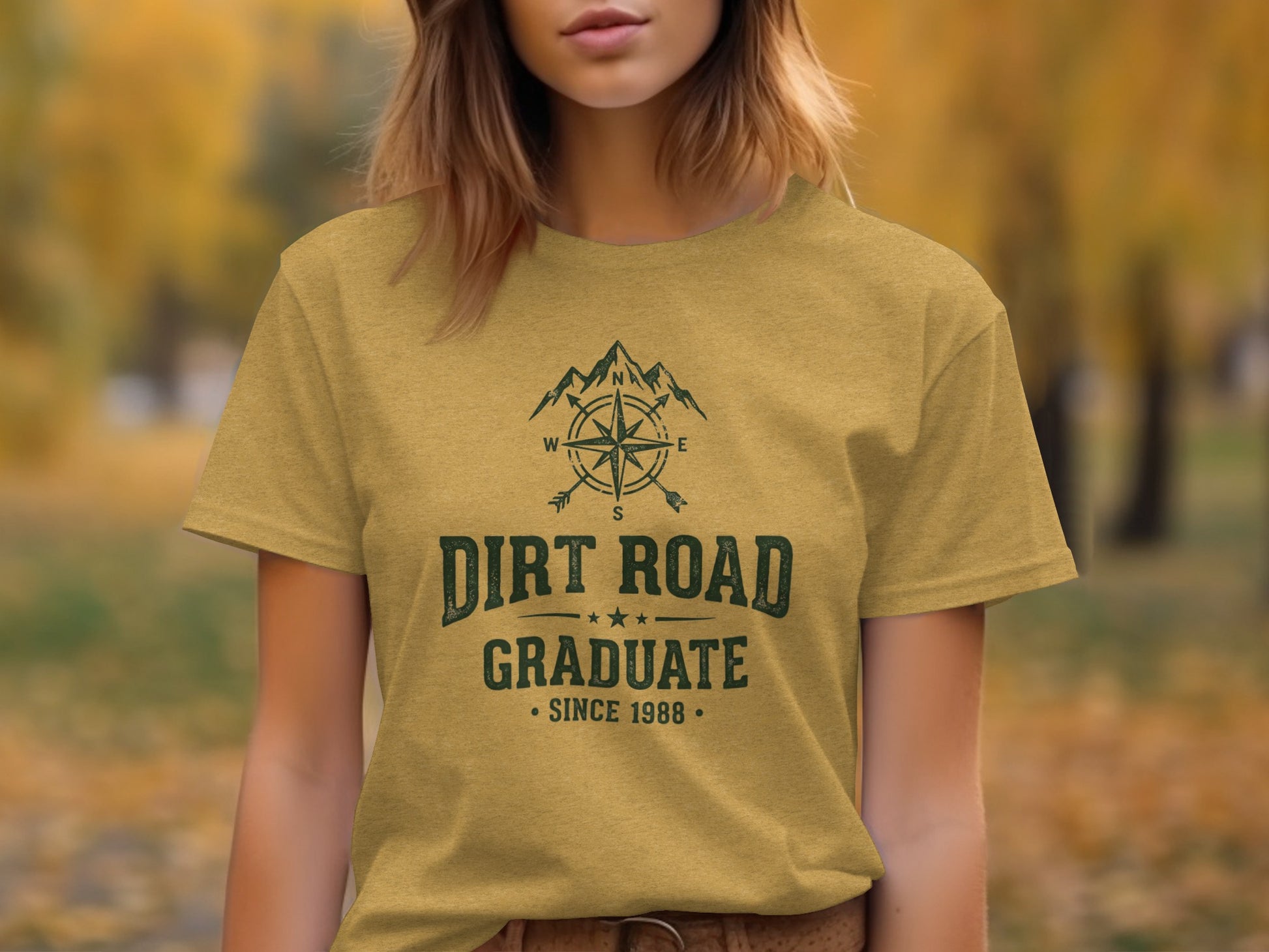 The Original Dirt Road Graduate Outdoor Adventure Top: T-shirt with "Dirt Road Graduate" text, compass, and mountain graphic.