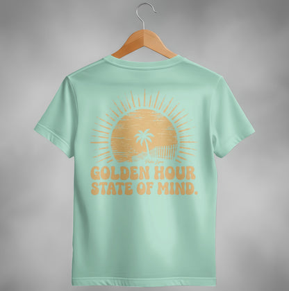Mint t-shirt with "Golden Hour State of Mind" text and a sunset graphic.