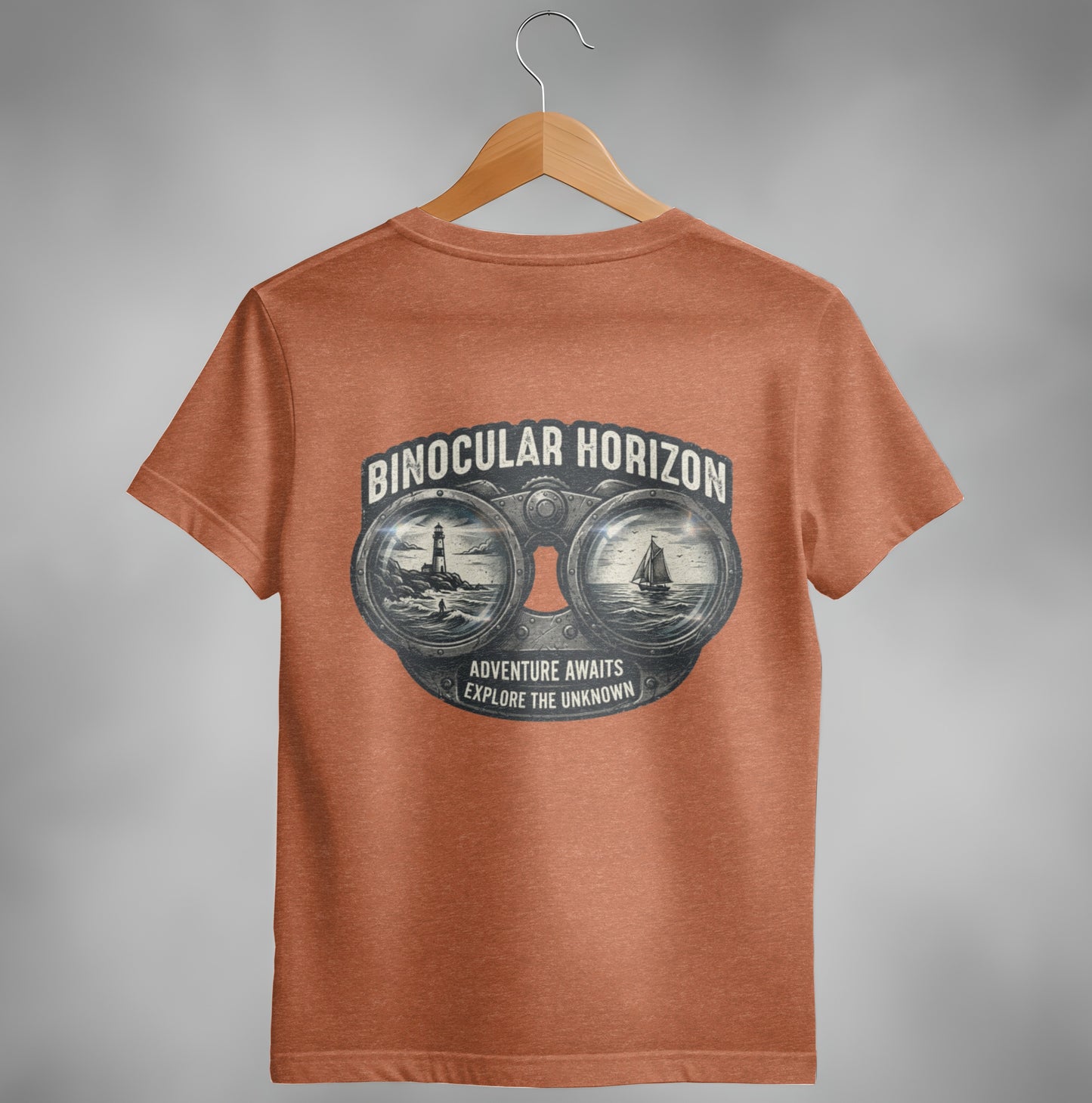 Orange t-shirt with binoculars graphic showing lighthouse, boat, and text.