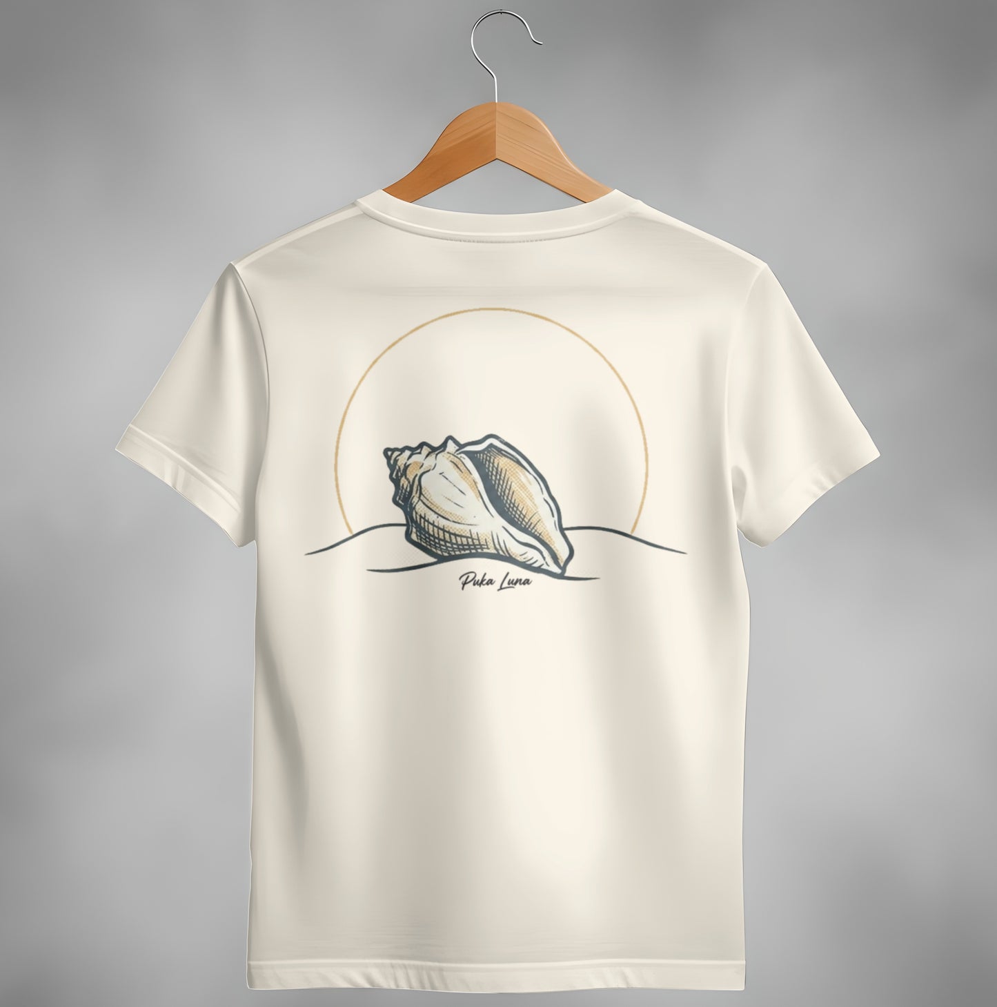 T-shirt with seashell graphic and "Poko Luna" text on a sandy landscape.