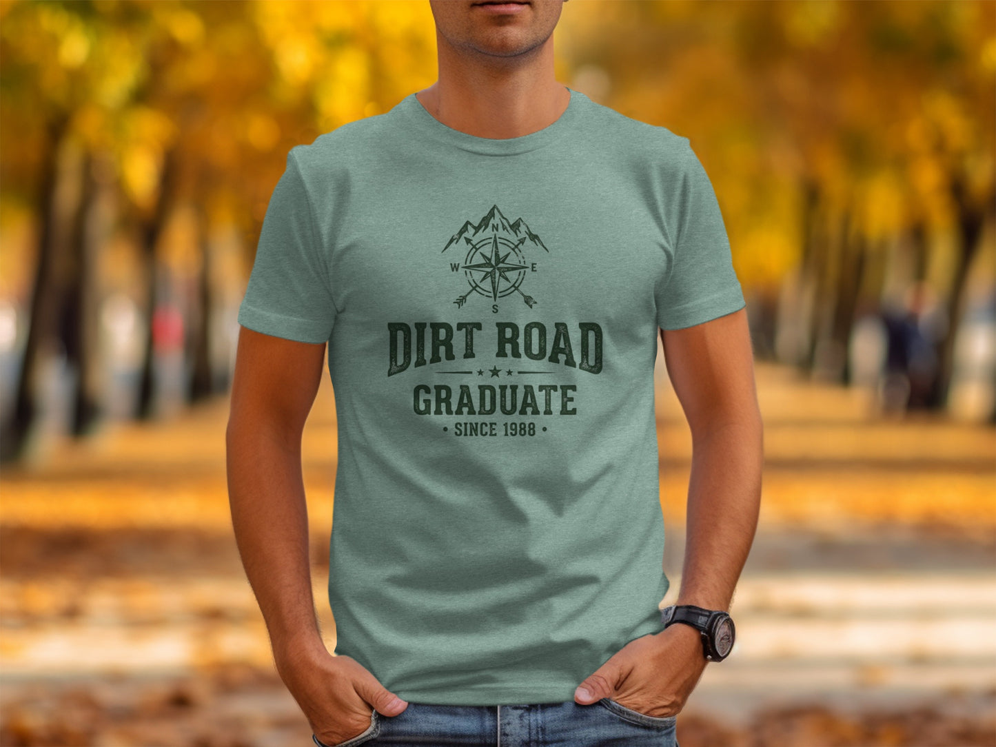 The Original Dirt Road Graduate Outdoor Adventure Top: Sage green t-shirt with compass and "Dirt Road Graduate Since 1988" text.