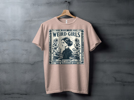 T-shirt with "WEIRD GIRLS CLUB" text and a vintage illustration of a woman reading.