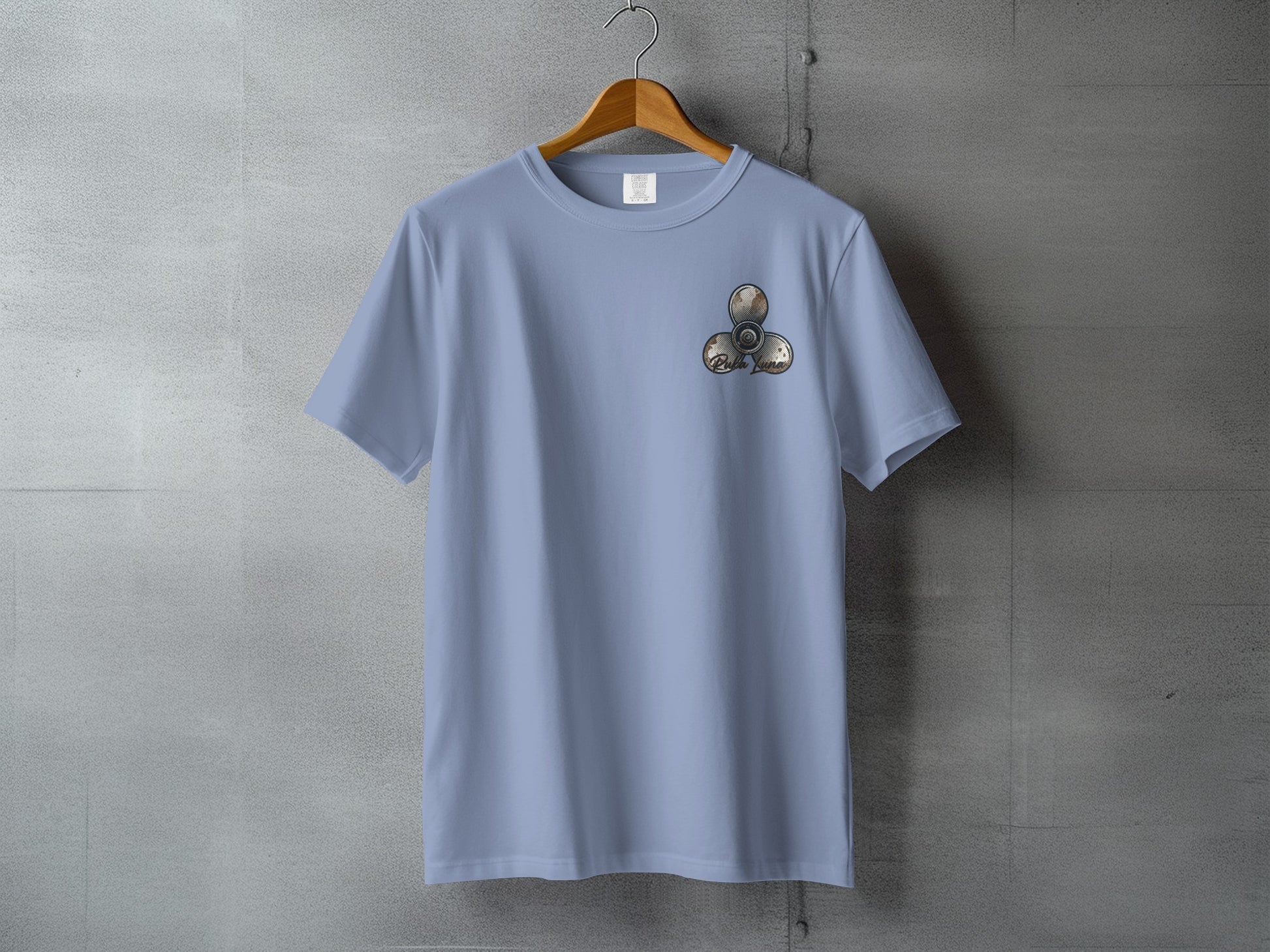 Light blue t-shirt with a three-pronged spinner graphic on the chest.