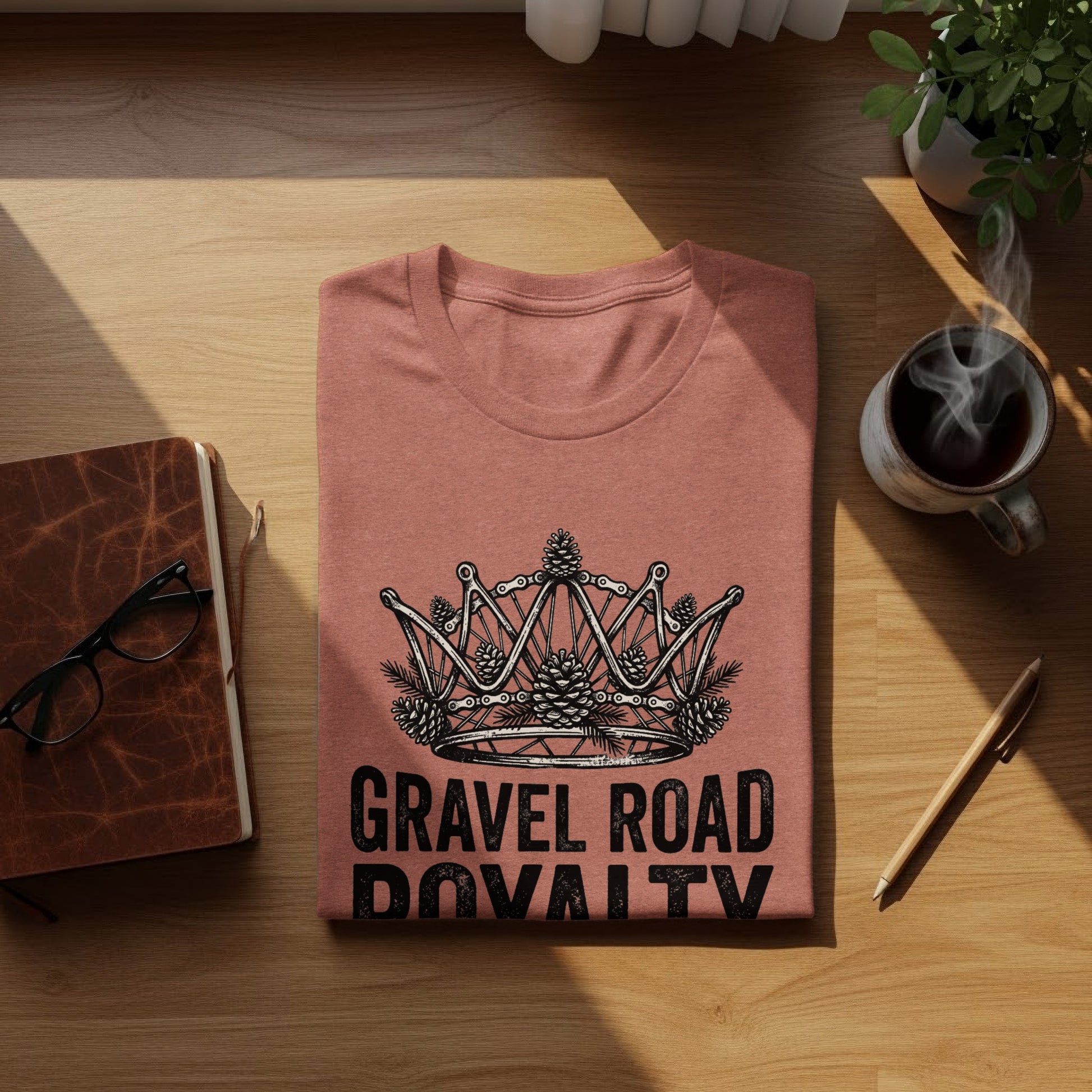 Gravel Road Royalty: Backcountry Outpost Shirt: Coral t-shirt with a crown graphic and "Gravel Road Royalty" text.