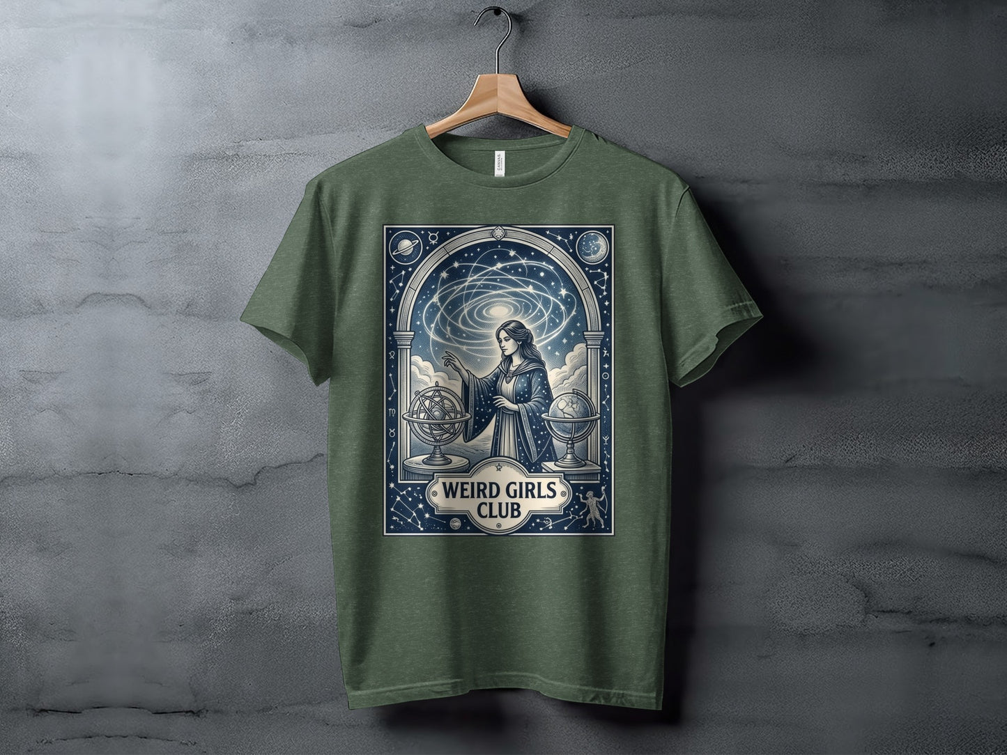 Green t-shirt with a celestial scene and "Weird Girls Club" text.