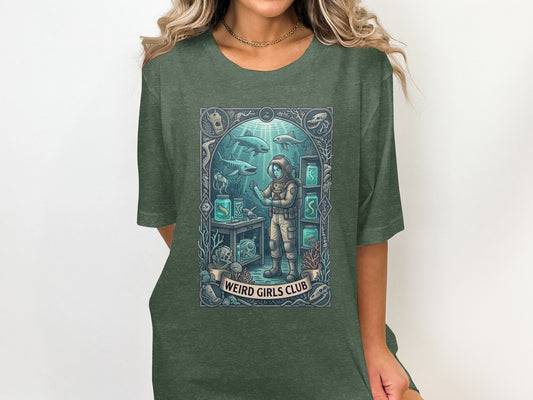 Woman in a t-shirt with a marine biology graphic featuring an astronaut and sea creatures.