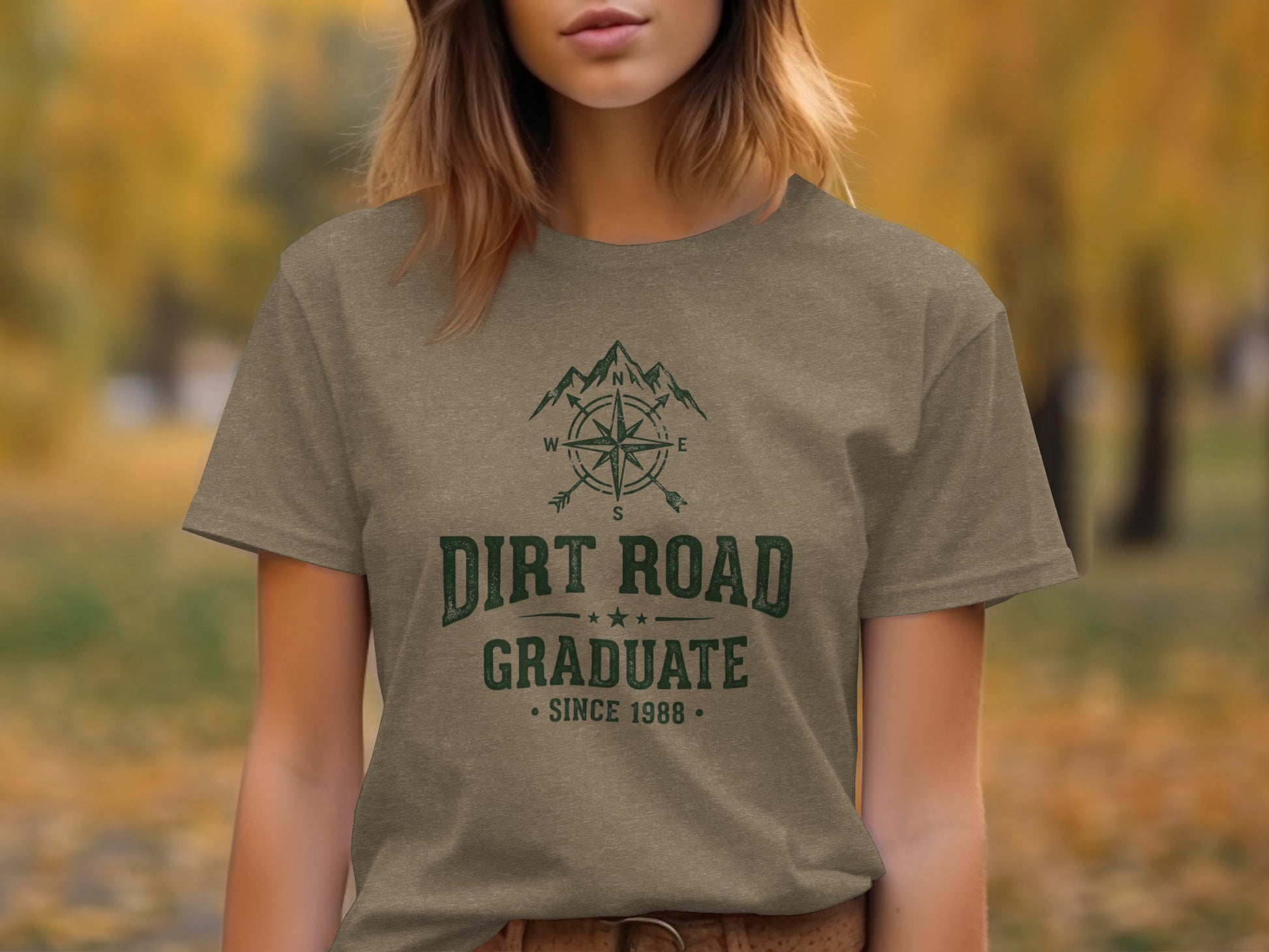 The Original Dirt Road Graduate Outdoor Adventure Top: Brown t-shirt with "DIRT ROAD GRADUATE SINCE 1988" and compass graphic.