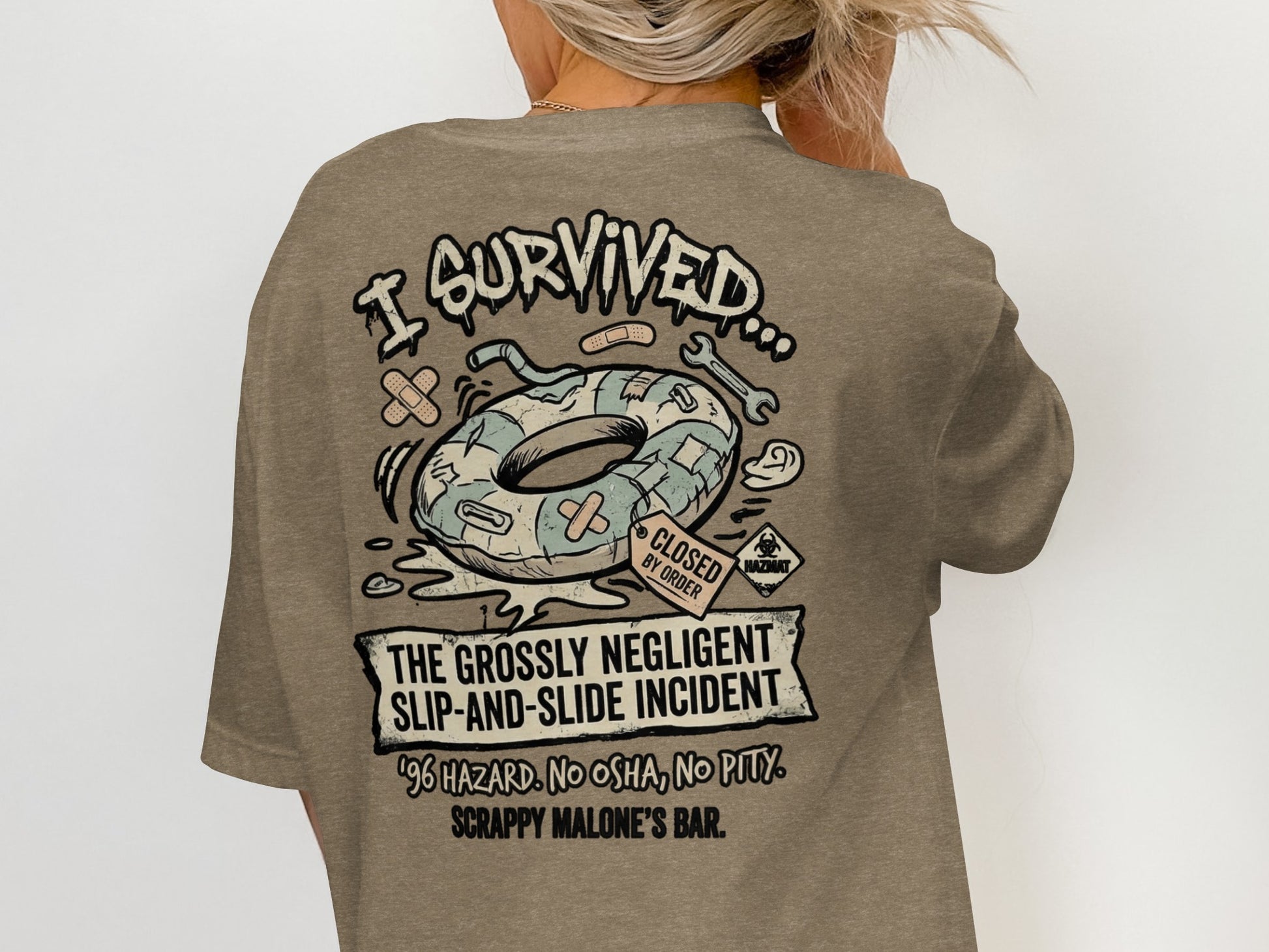 T-shirt graphic: "I Survived The Grossly Negligent Slip-and-Slide Incident" with a donut inner tube.