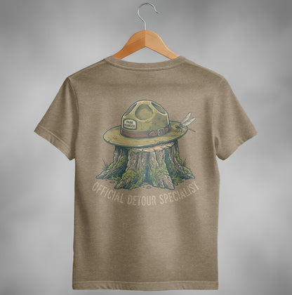 T-shirt with a ranger hat on a tree stump, featuring a dragonfly and "Official Detour Specialist" text.
