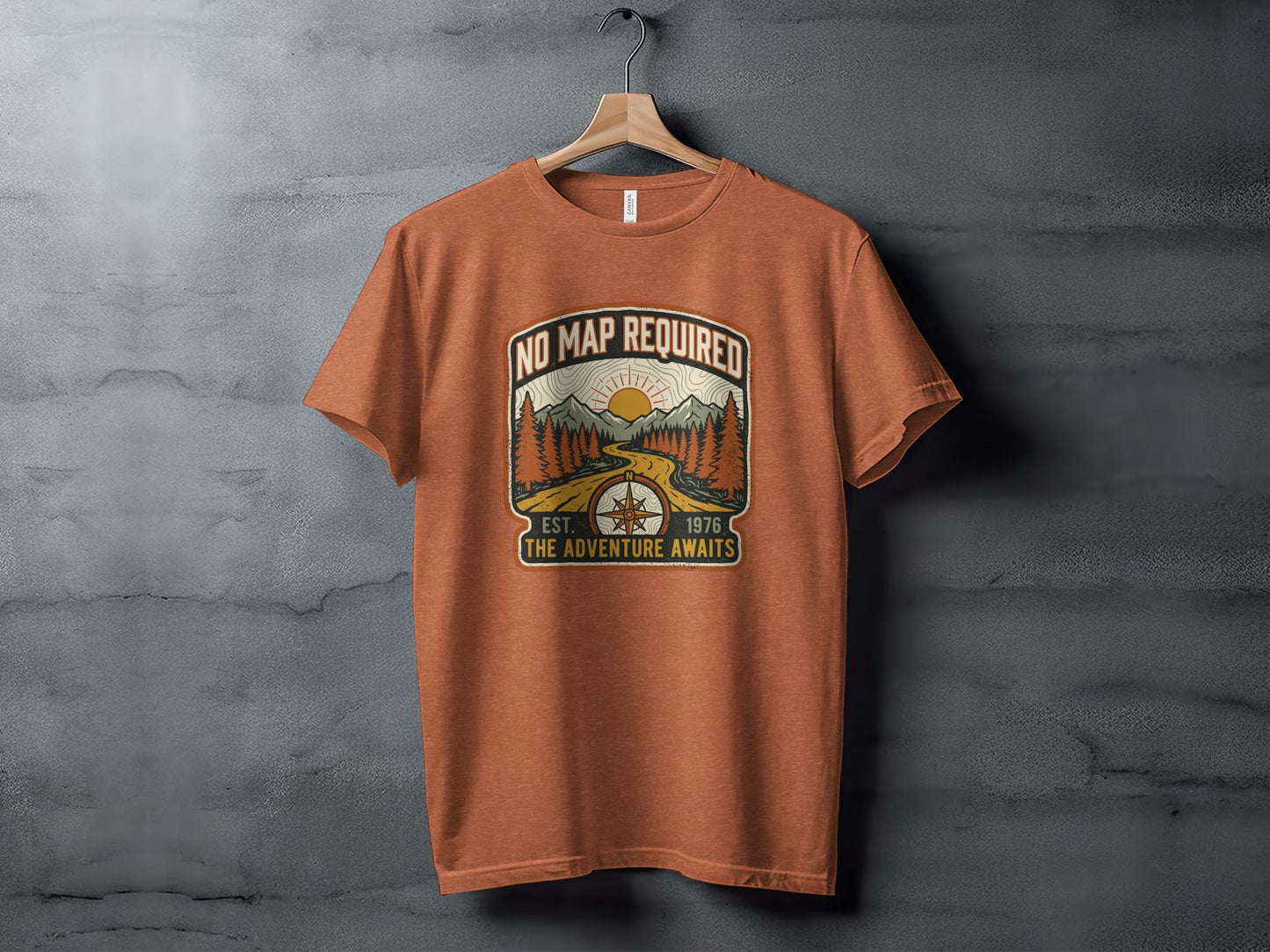 Heritage No Map Required: The Adventure Awaits Nomad Tee: Orange t-shirt with "No Map Required" graphic featuring mountains and a road.