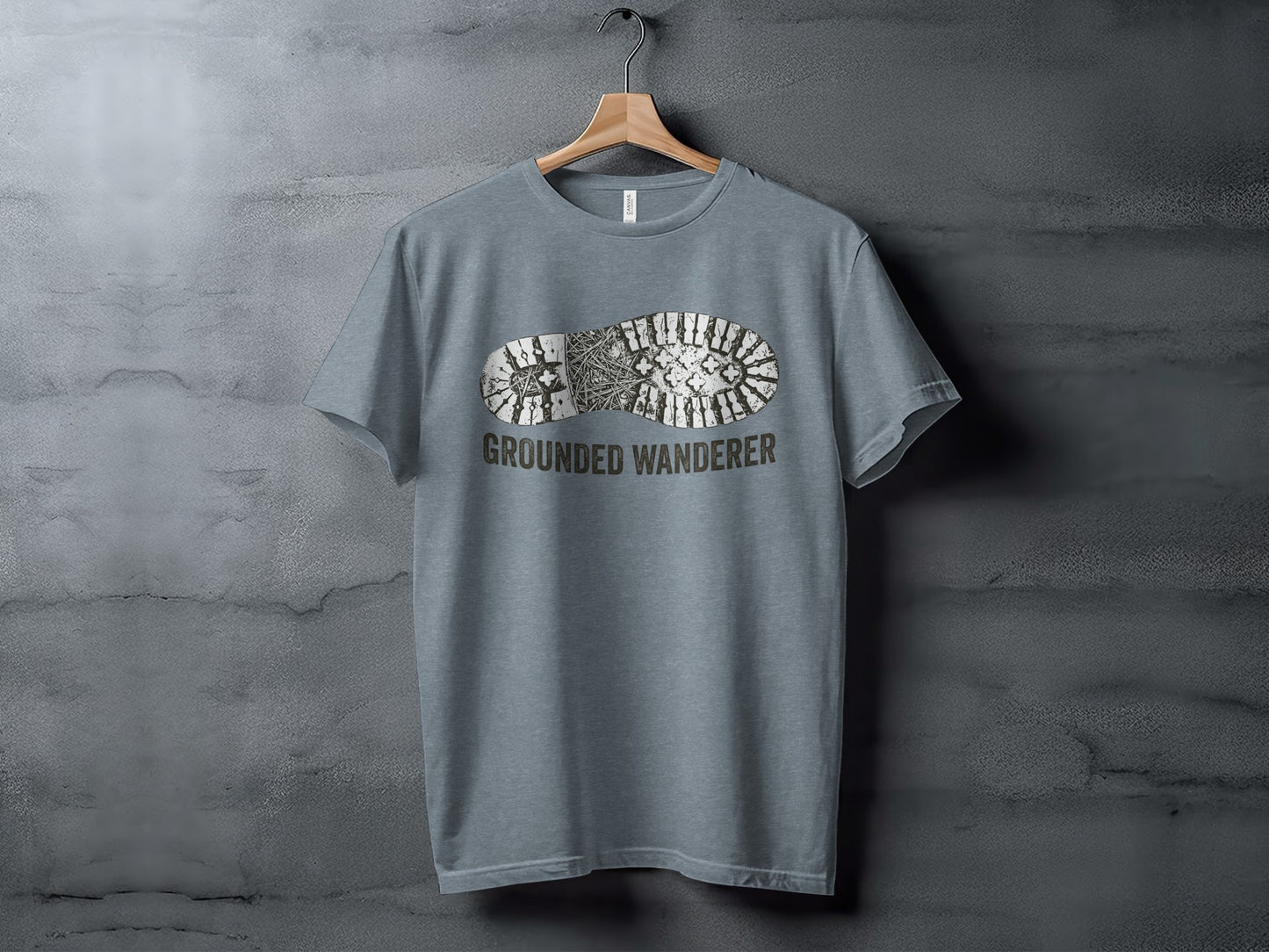 Grounded Wanderer Boot Print | Vintage Outdoor Apparel: Gray t-shirt with a boot print and "GROUNDED WANDERER" text.