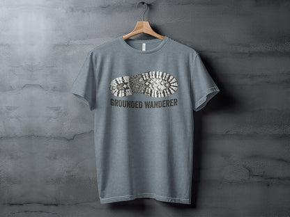 Grounded Wanderer Boot Print | Vintage Outdoor Apparel: Gray t-shirt with a boot print and "GROUNDED WANDERER" text.