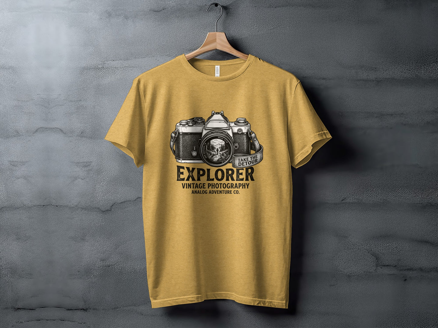 The Analog Explorer's Detour: Backcountry Outpost Shirt: Yellow t-shirt with vintage camera graphic and "Explorer" text.