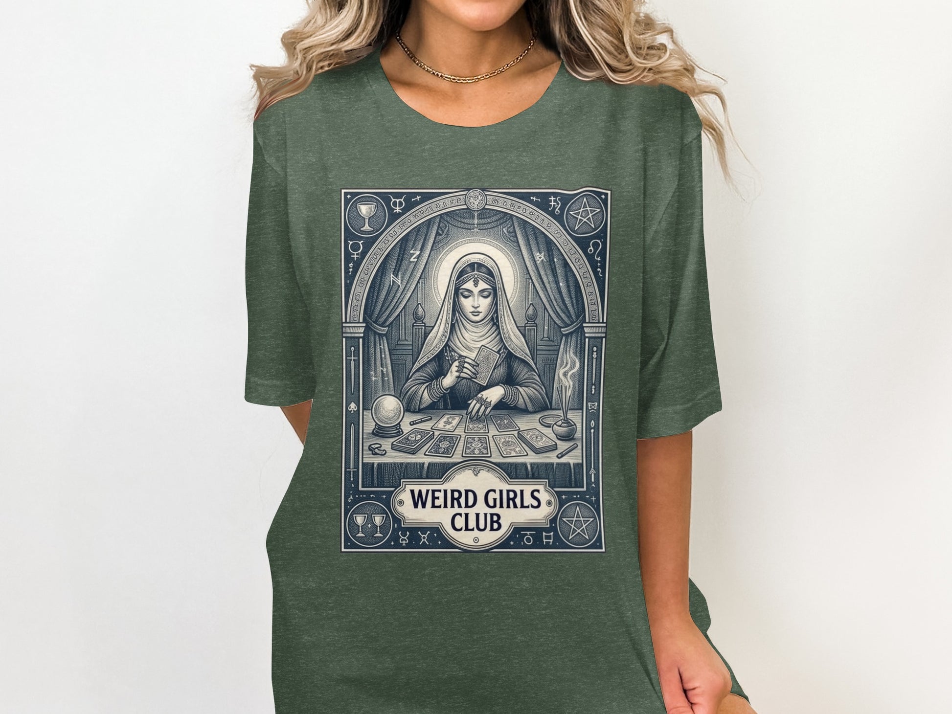 Green t-shirt with tarot reader and "Weird Girls Club" text design.