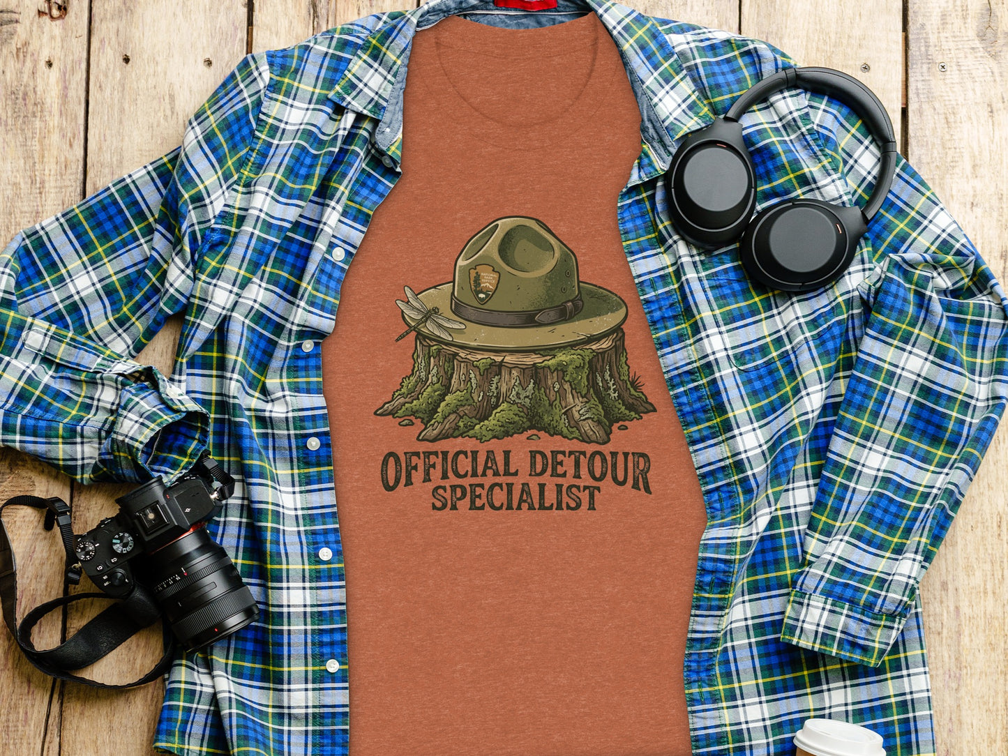 Official Detour Specialist Heritage | Vintage Outdoor Apparel: T-shirt with park ranger hat on stump, "Official Detour Specialist" text.