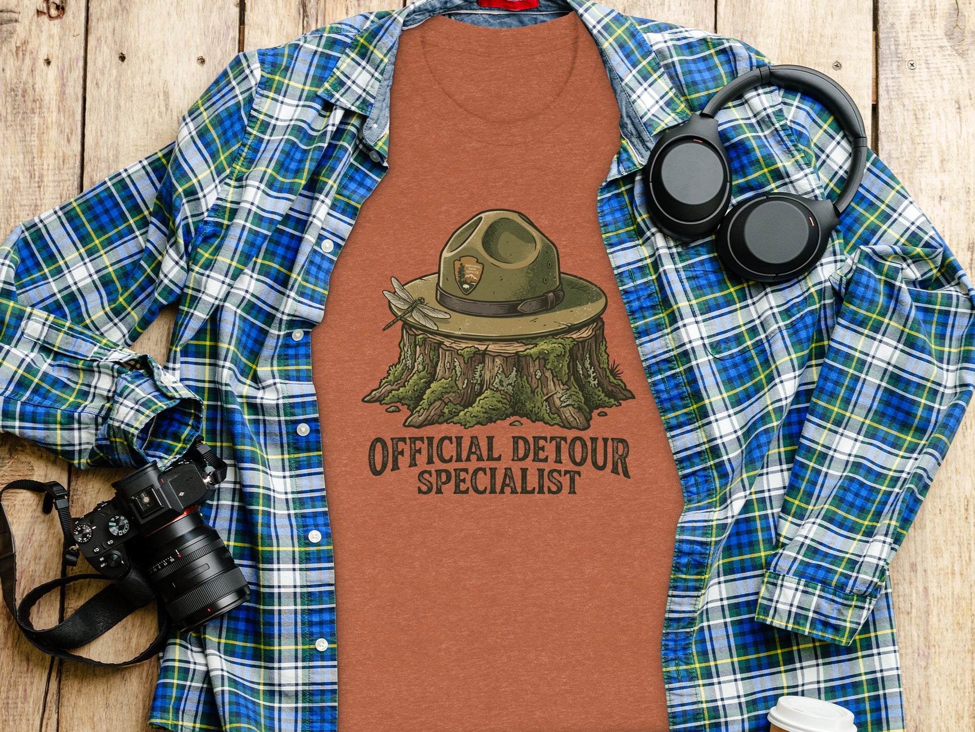 Official Detour Specialist Heritage | Vintage Outdoor Apparel: T-shirt with park ranger hat on stump, "Official Detour Specialist" text.