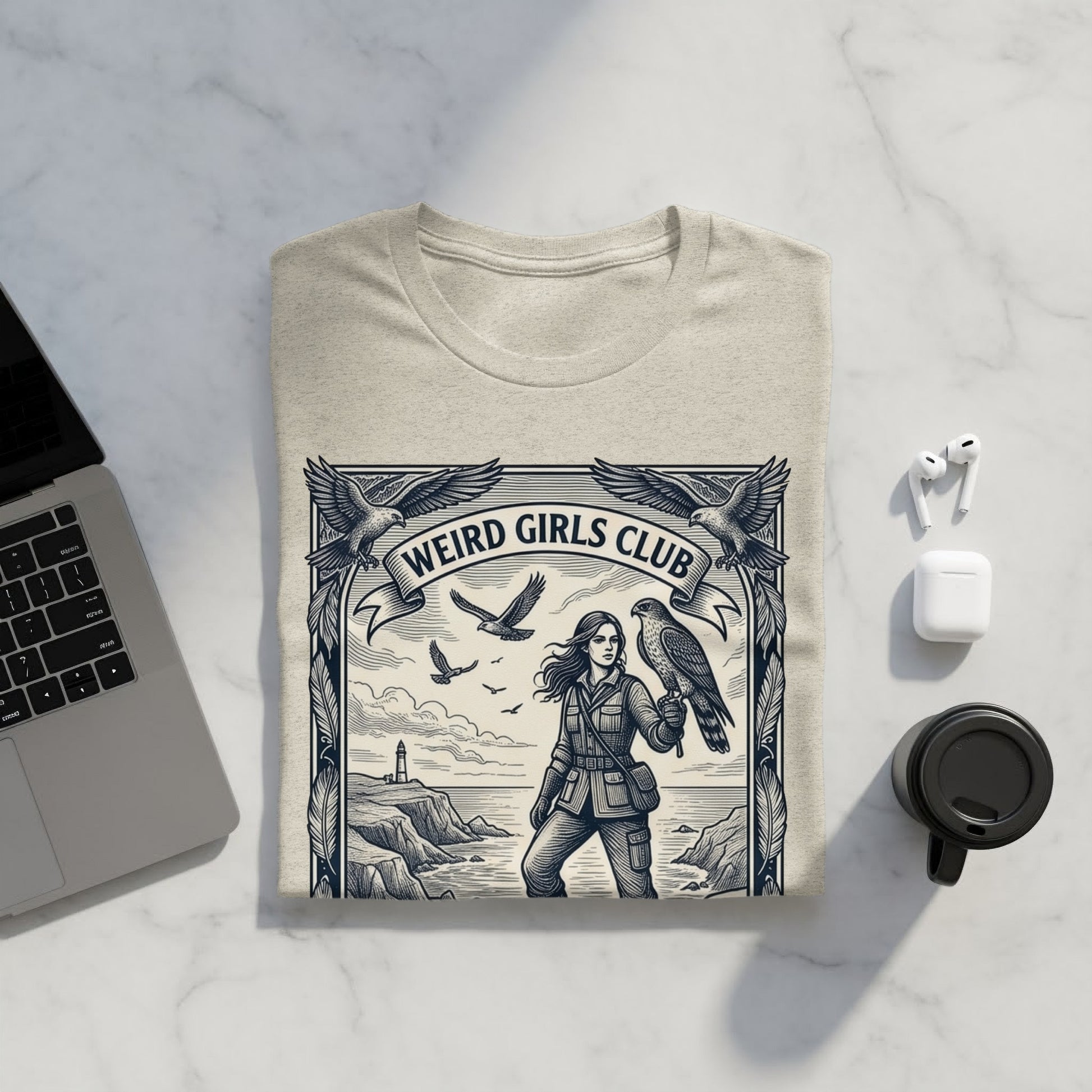T-shirt with "WEIRD GIRLS CLUB" text, featuring a woman with a hawk and birds.