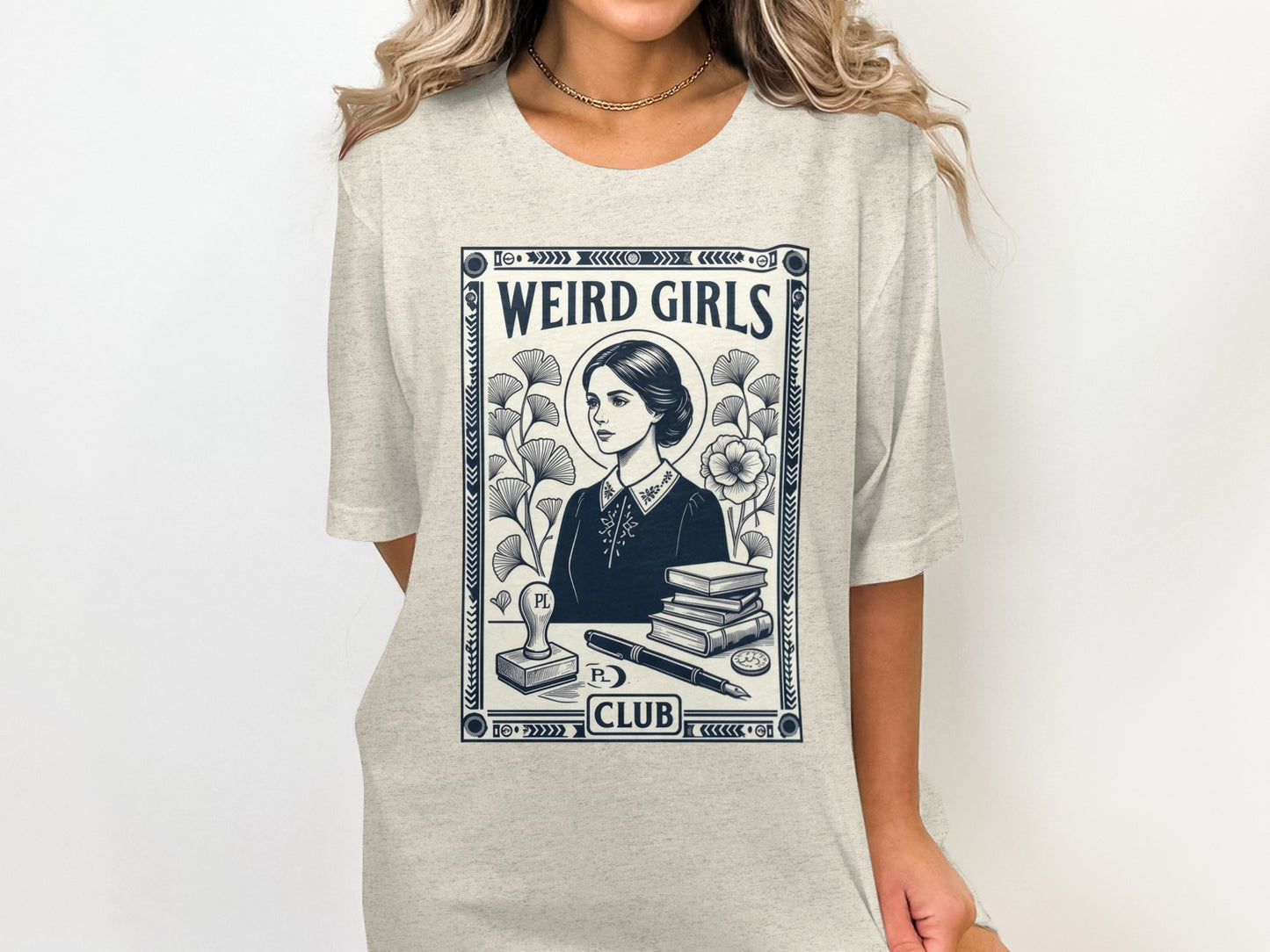 T-shirt graphic featuring a woman and books with text "WEIRD GIRLS CLUB".