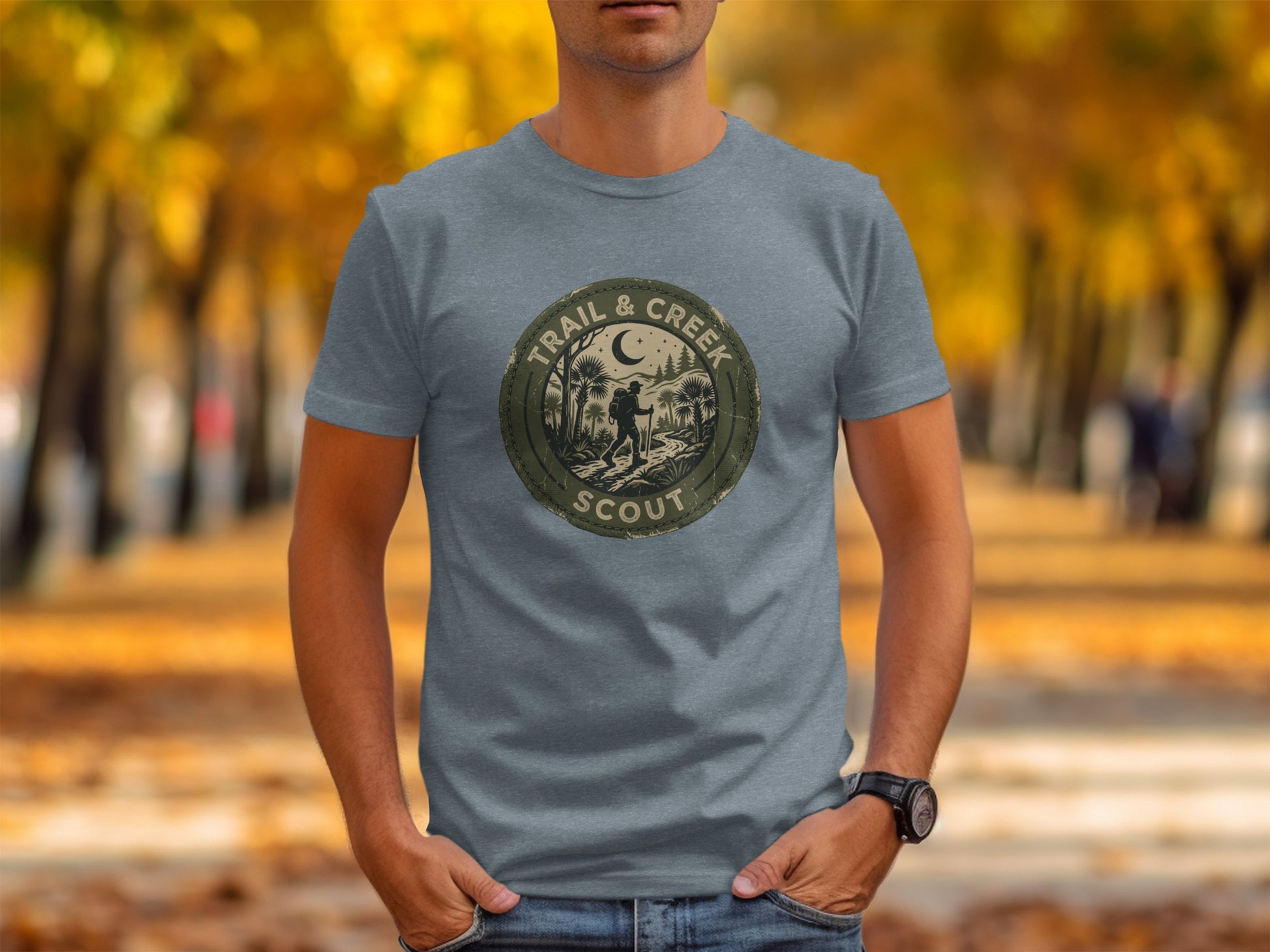 Heritage Trail & Creek Scout Adventure Nomad Tee: Grey t-shirt with circular "Trail & Creek Scout" logo featuring a hiker.