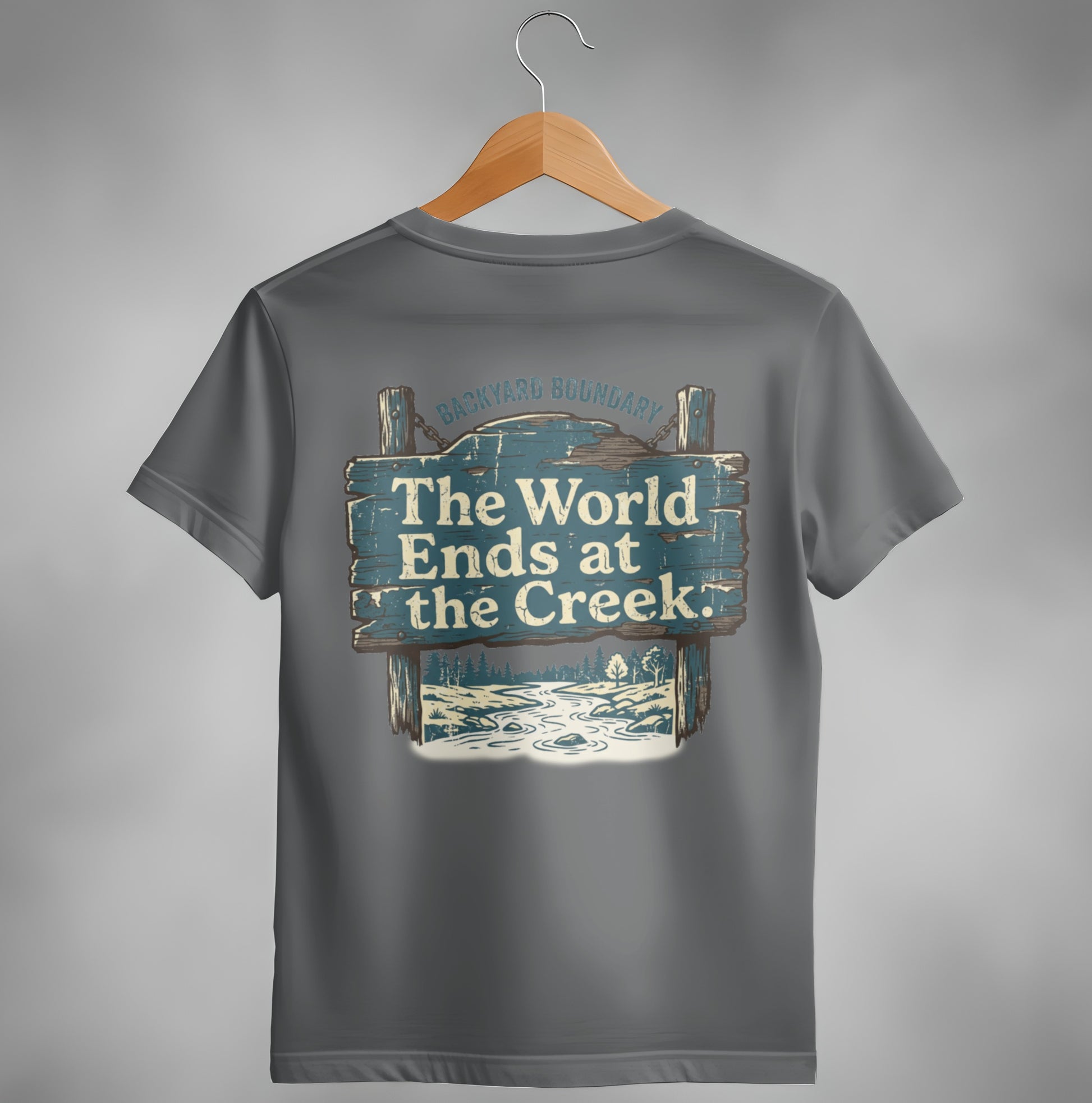 Gray t-shirt with "The World Ends at the Creek" text on wooden sign graphic.