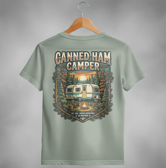 T-shirt with vintage "Canned Ham Camper" graphic featuring a trailer, campfire, and trees.