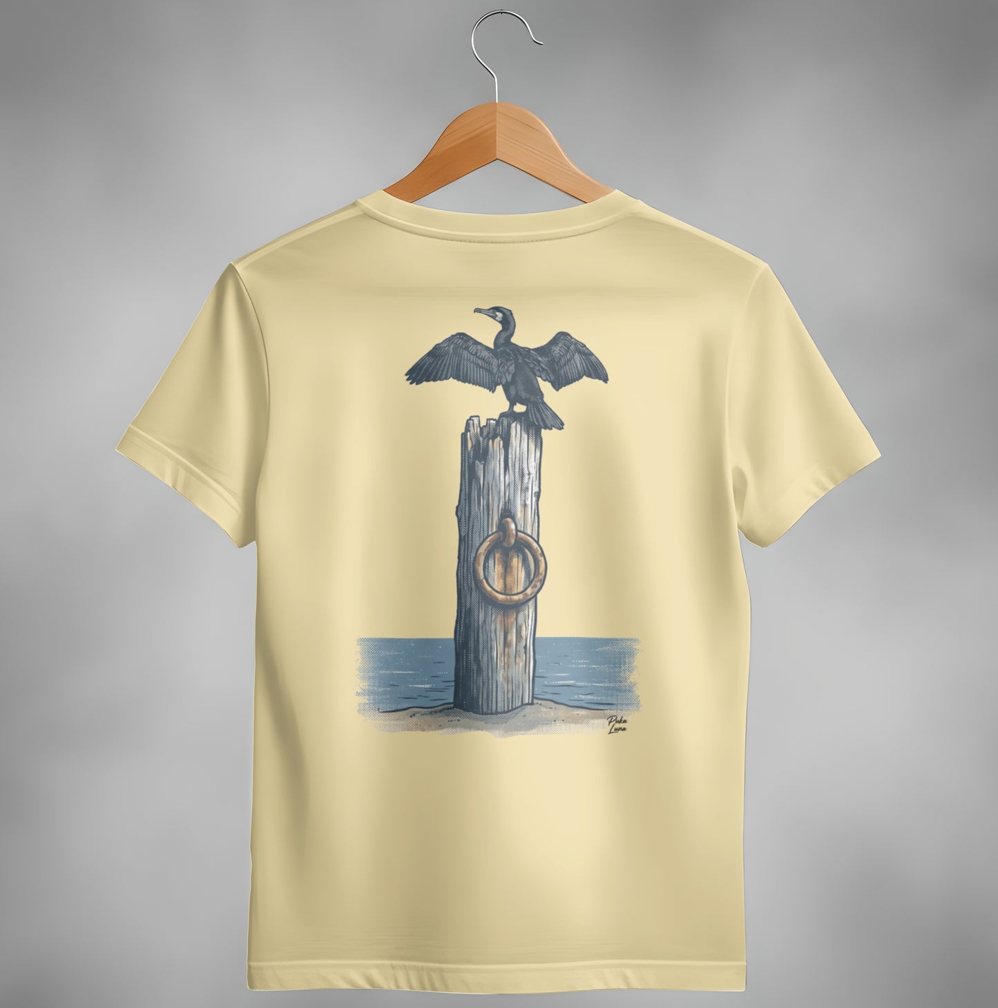 Cream t-shirt with a cormorant on a post with a ring.