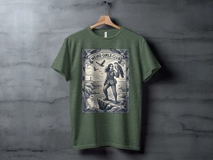 Green t-shirt with "Weird Girls Club" logo and woman with hawk on cliff.