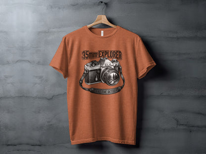 35mm Explorer Detour | Vintage Outdoor Apparel: Orange t-shirt with a vintage SLR camera graphic and "35mm EXPLORER" text.