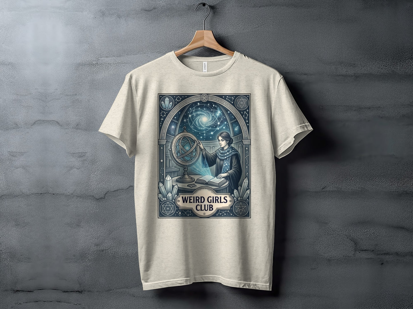 T-shirt with a woman studying a celestial globe and astrological symbols.