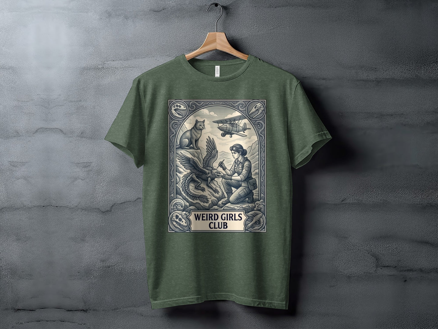 T-shirt graphic: Woman with eagle and biplane, "Weird Girls Club" text.