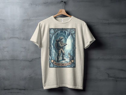 Astronaut and cat in icy cave, "Weird Girls Club" text banner.