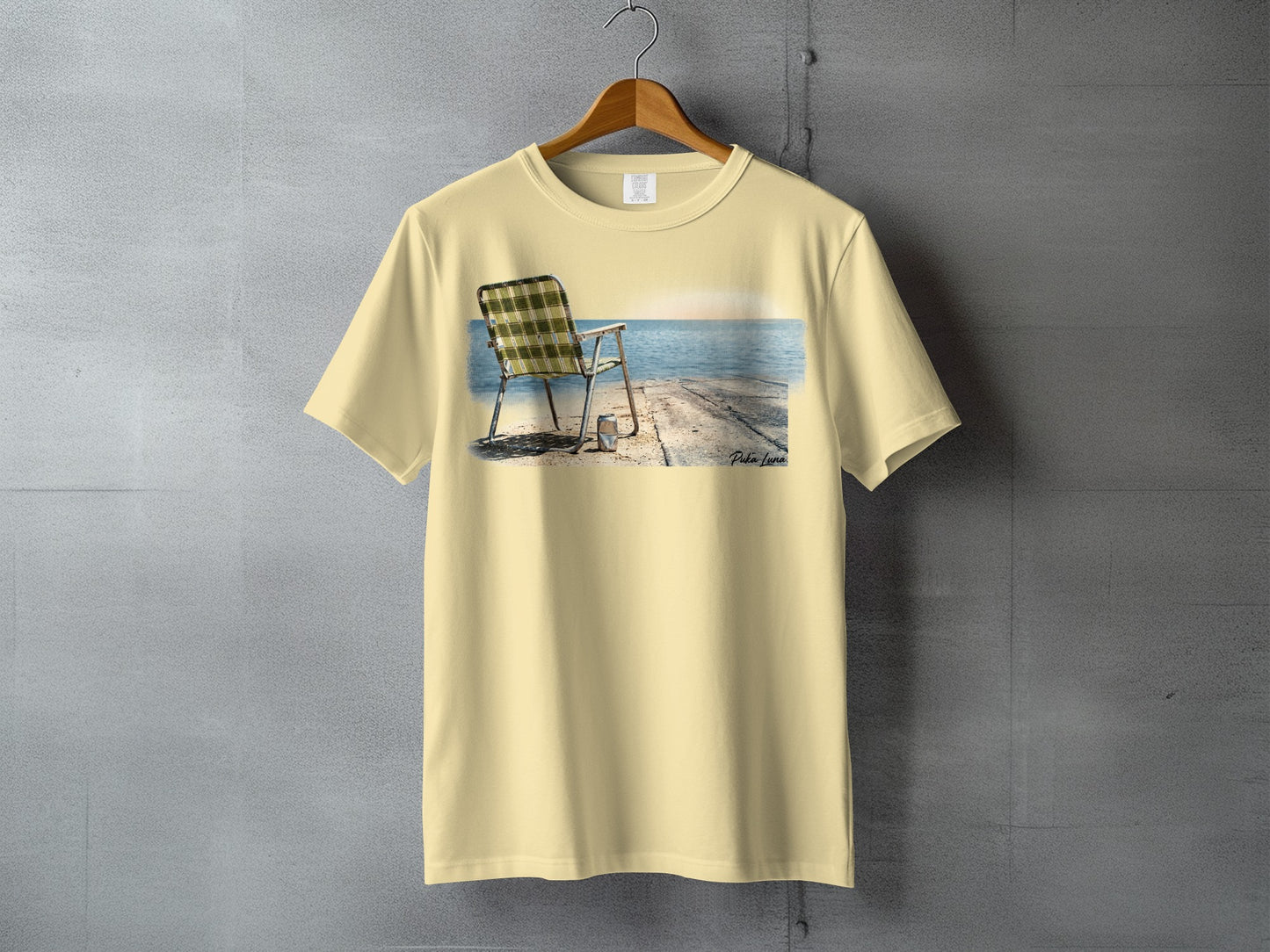 T-shirt mockup with a beige t-shirt featuring a beach chair on a pier.