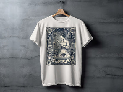 White t-shirt with "Weird Girls Club" emblem featuring a woman examining a spider.