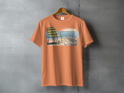 Orange t-shirt with a beach scene featuring a chair and a sunset.