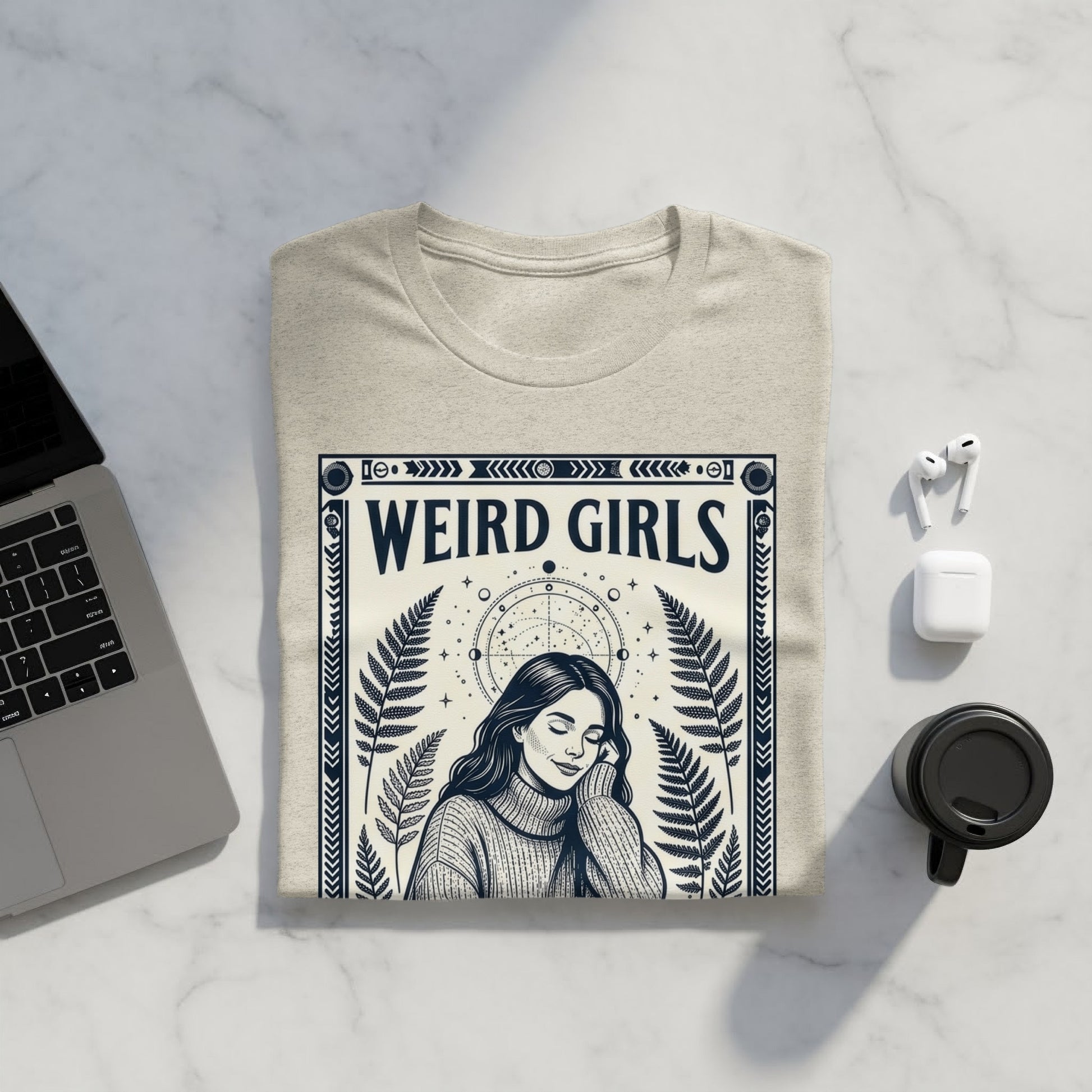 Beige t-shirt with "WEIRD GIRLS" text and celestial design.