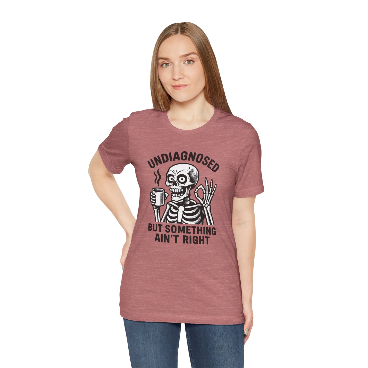 Person wearing a t-shirt with a skeleton graphic and text on a white background