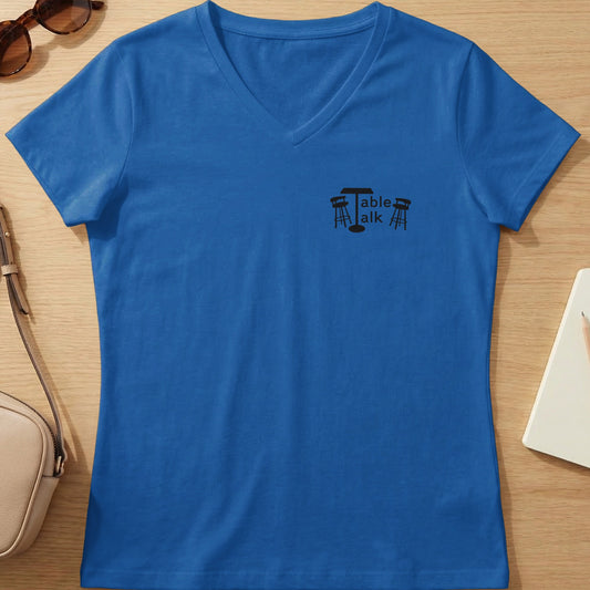 Blue v-neck t-shirt with a black "Table talk" logo featuring a table and two stools.