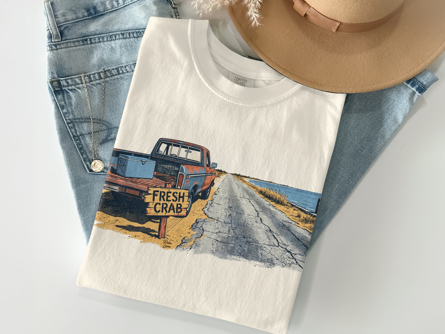 T-shirt featuring a vintage truck and "FRESH CRAB" sign on a road.